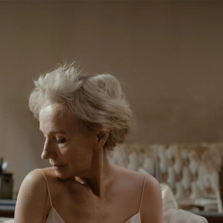 Older woman relaxing peacefully at home as an image for healthy aging.