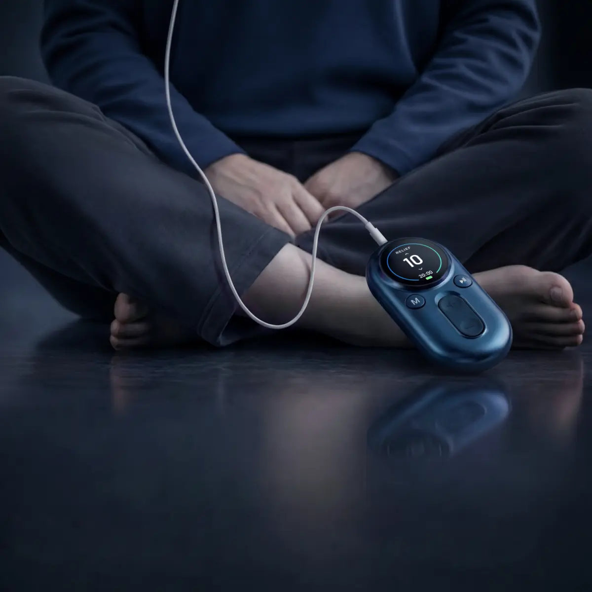 Person sitting comfortably with an adjustable ear-based VNS wellness device.
