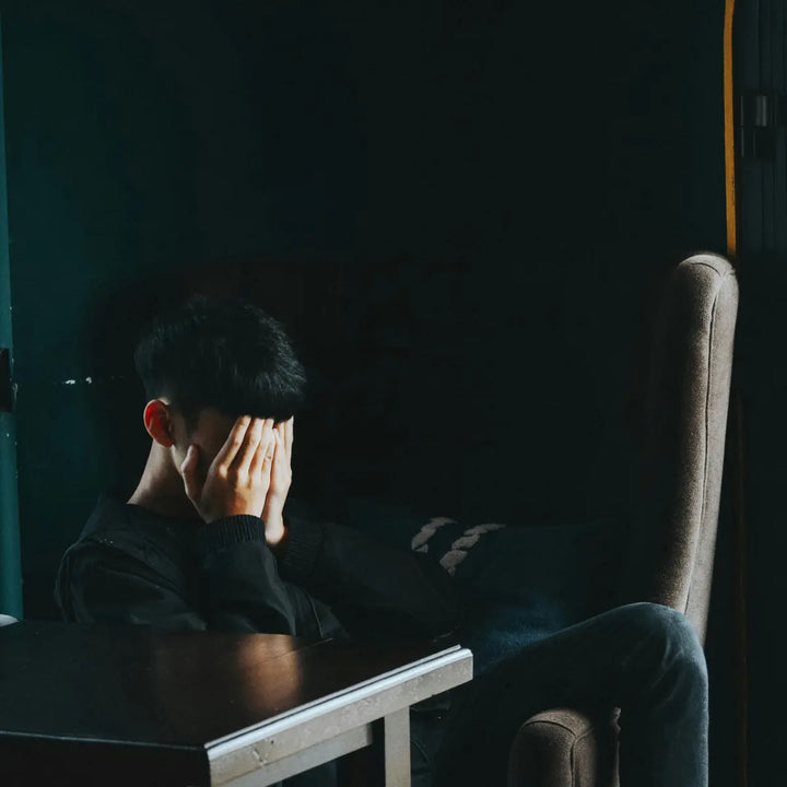 Person experiencing stress while trying to maintain focus and mental clarity during work