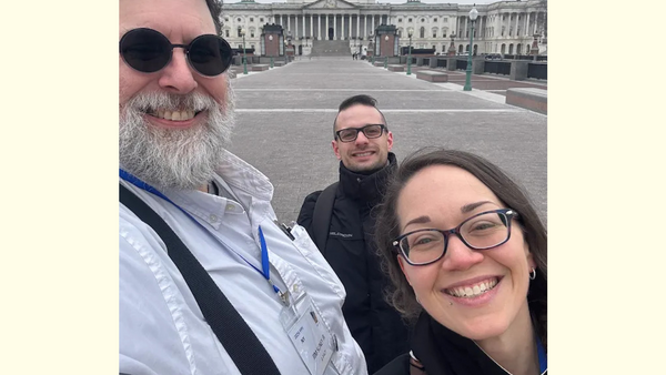 Team photo at the U.S. Capitol, representing advocacy and community support